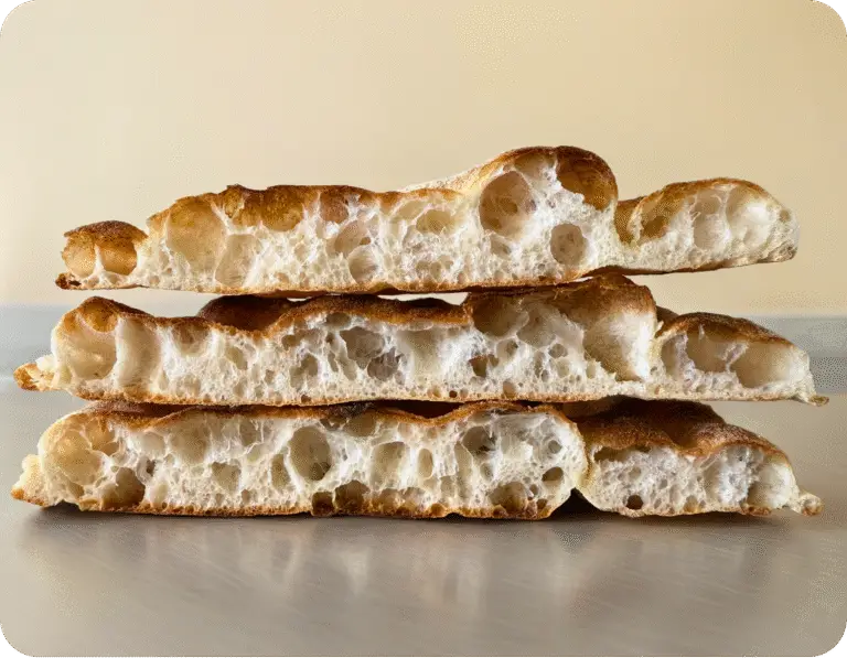 Freshly baked Roman Pinsa cut into sections – shelf-stable, handmade